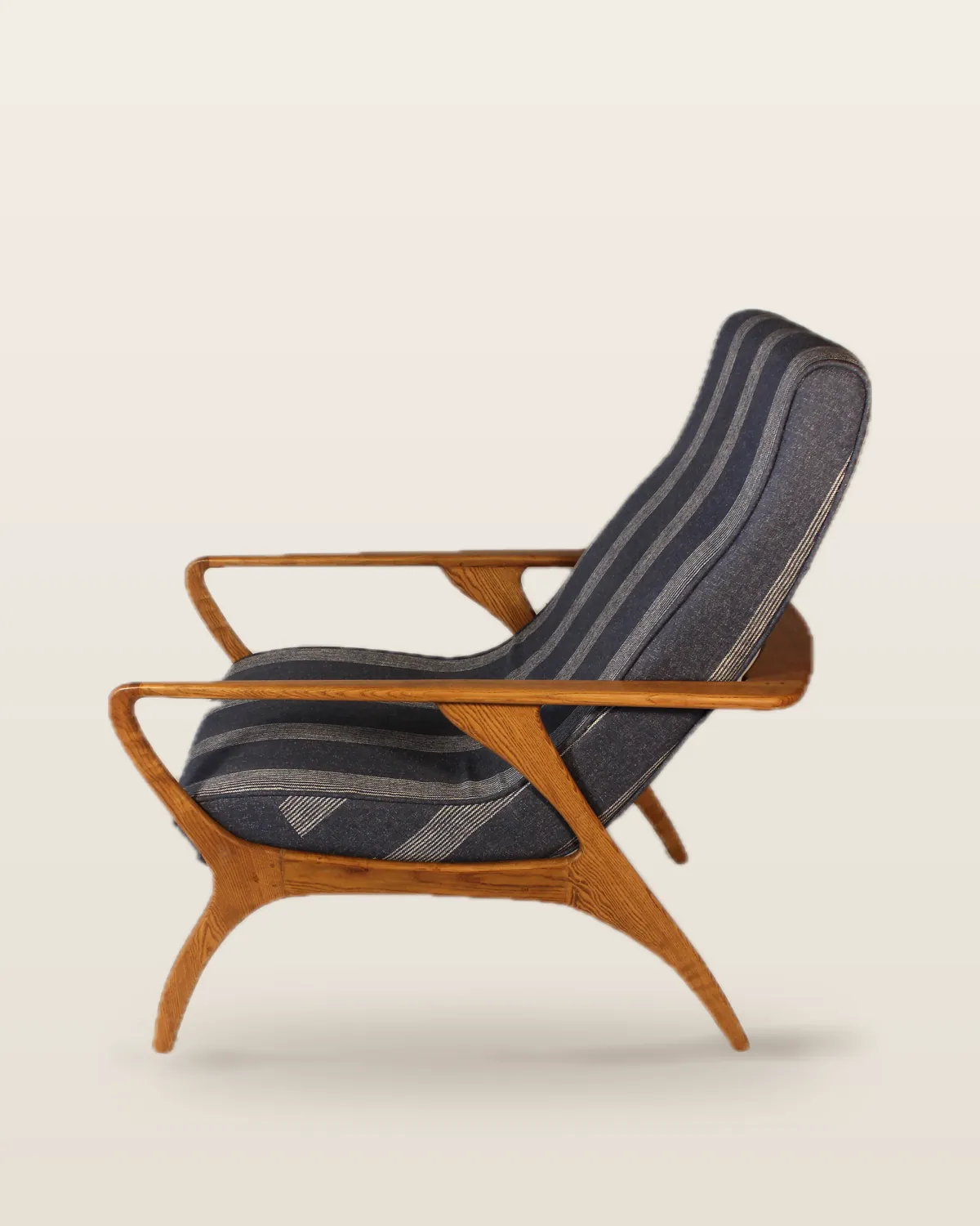 Striped high-back lounge chair, side view